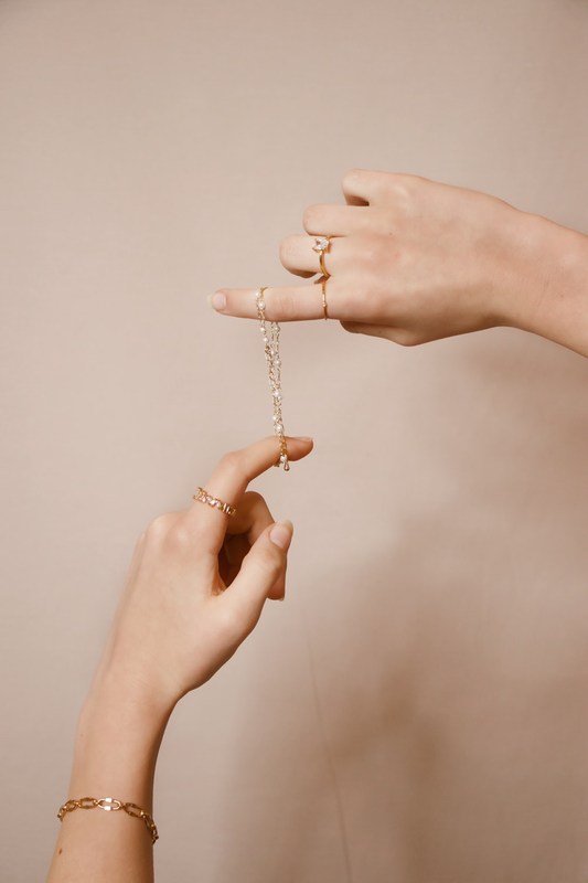 Bracelets and rings on two hands