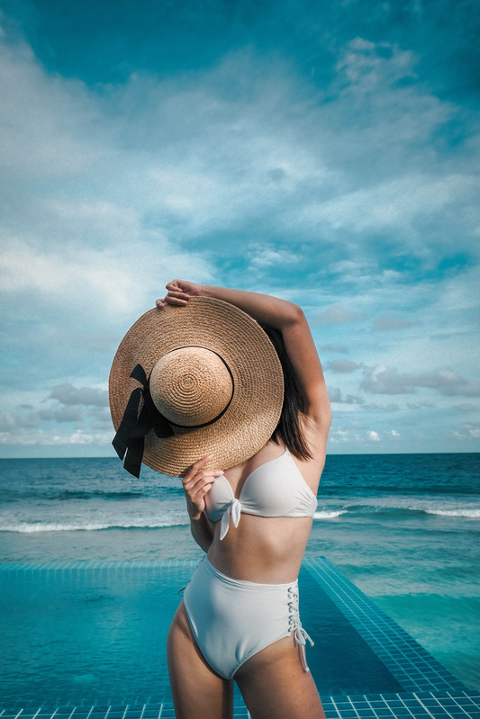 A woman wearing a white bikini